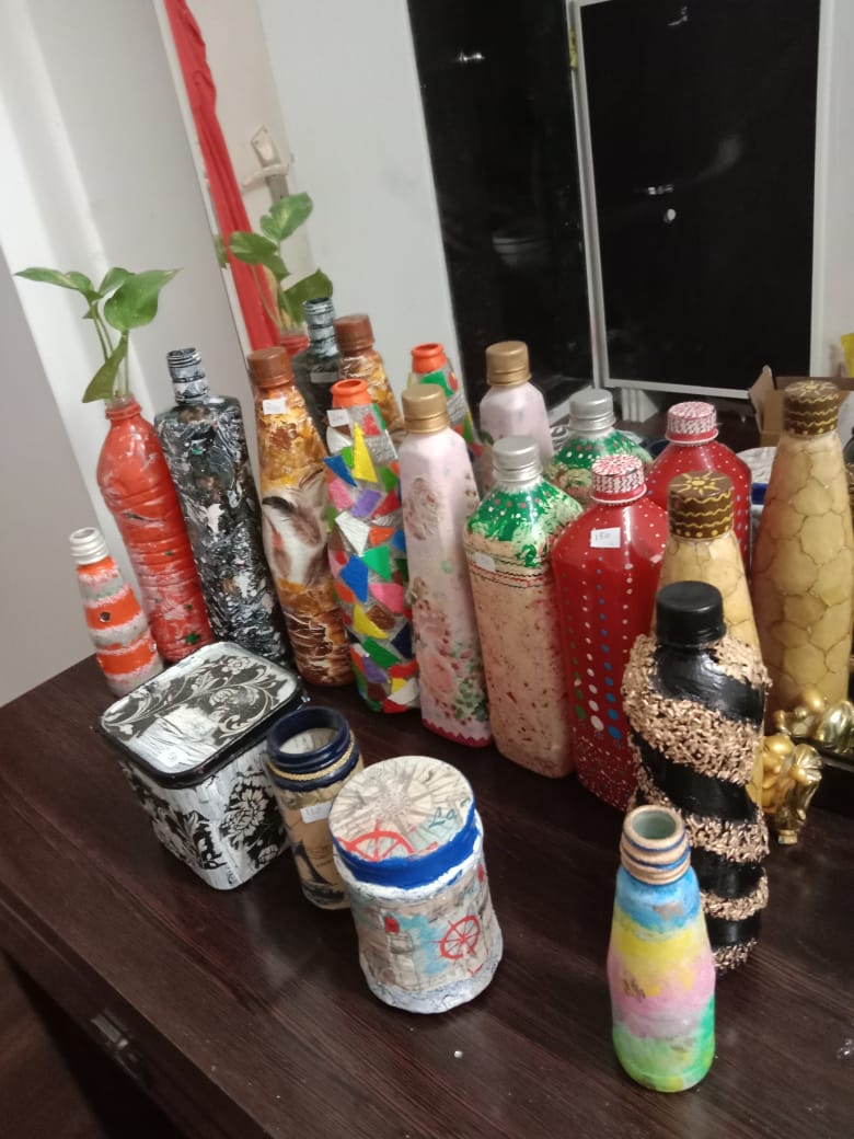 Hand-decorated glass bottles in a variety of colours