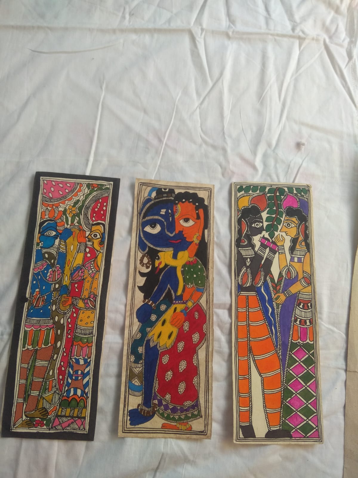 Colourful Madhubani-style painted panels from the supplied artwork collection