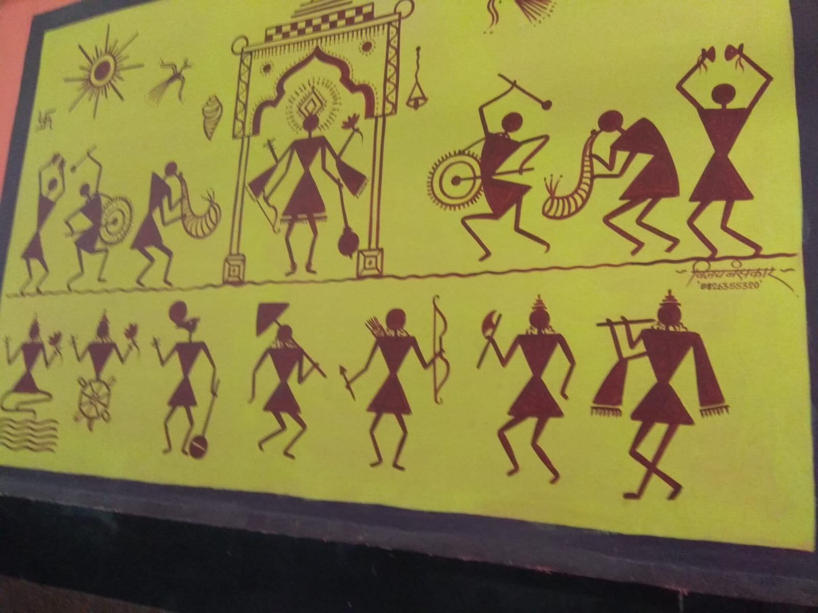 Warli-style figures in maroon on a yellow background